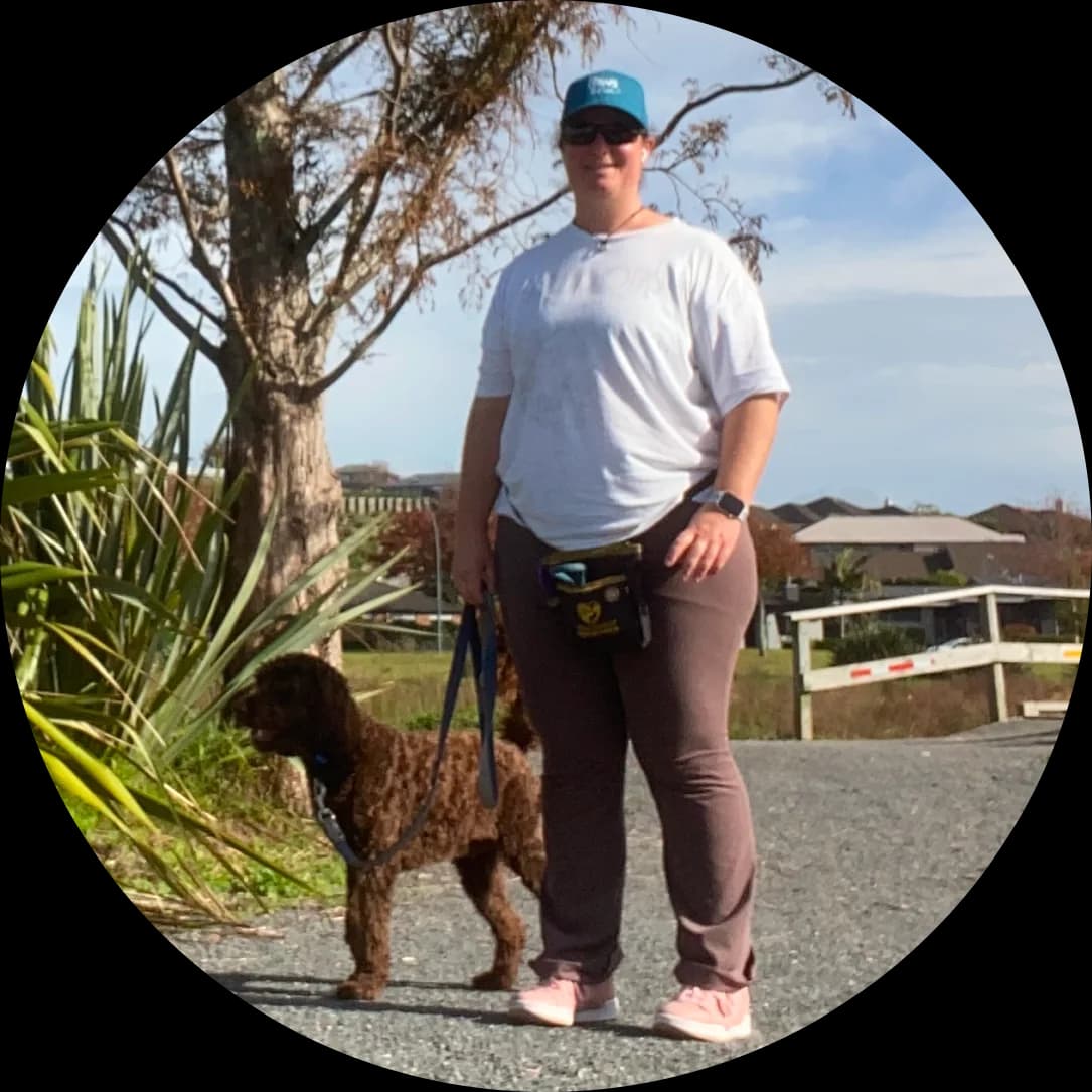 Brooke from Paws and Thrive walking a calm dog in Tauranga